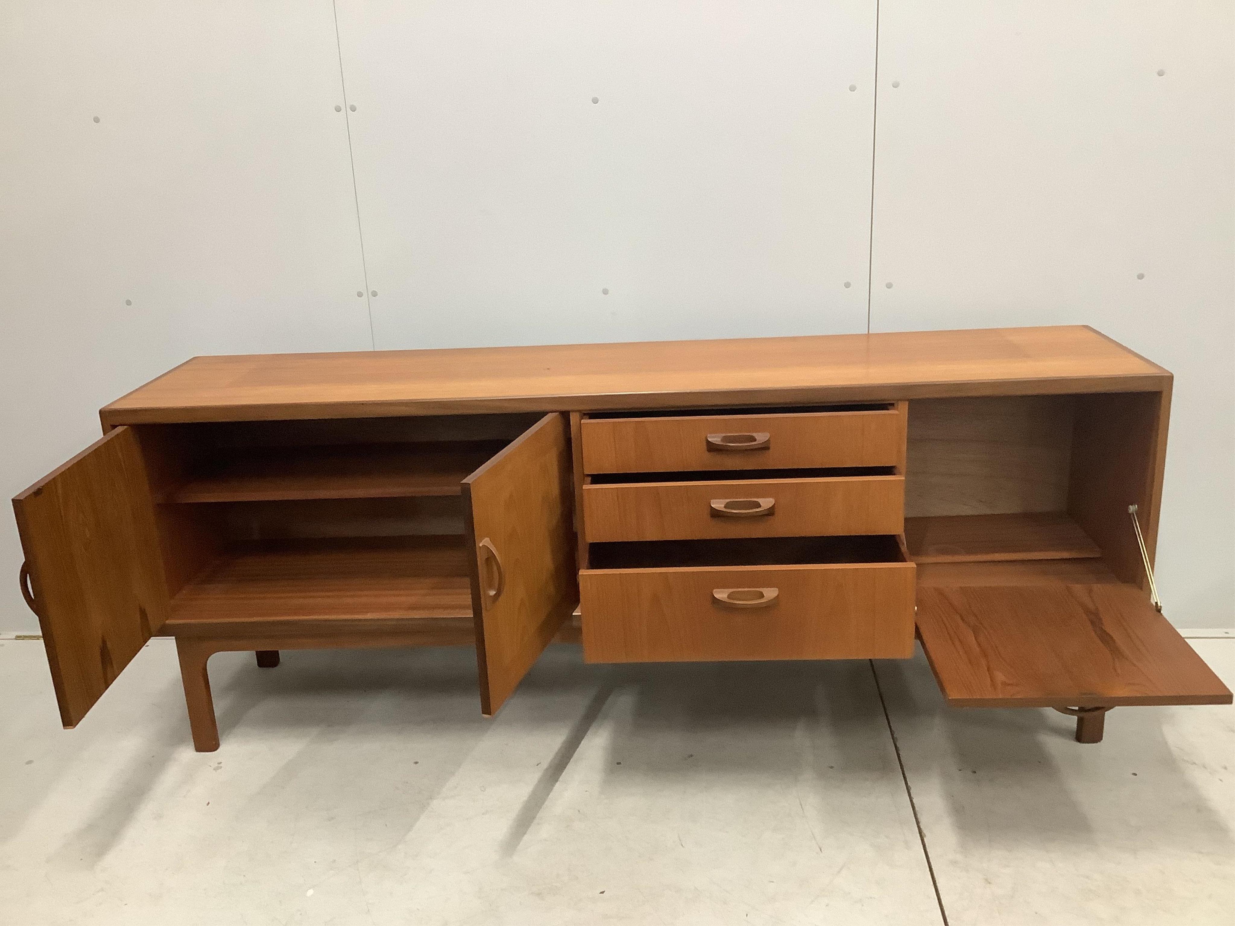 A mid century G Plan Sierra teak sideboard, width 205cm, depth 45cm, height 80cm. Condition - fair to good, some fading to top